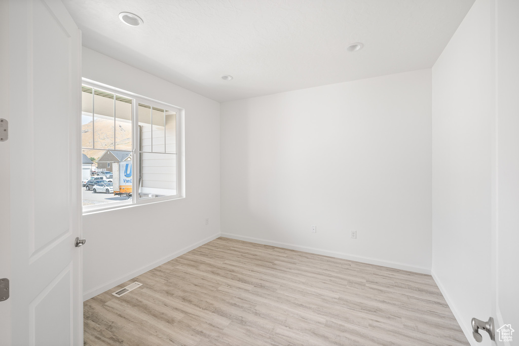 Empty room featuring light hardwood / wood-style floors