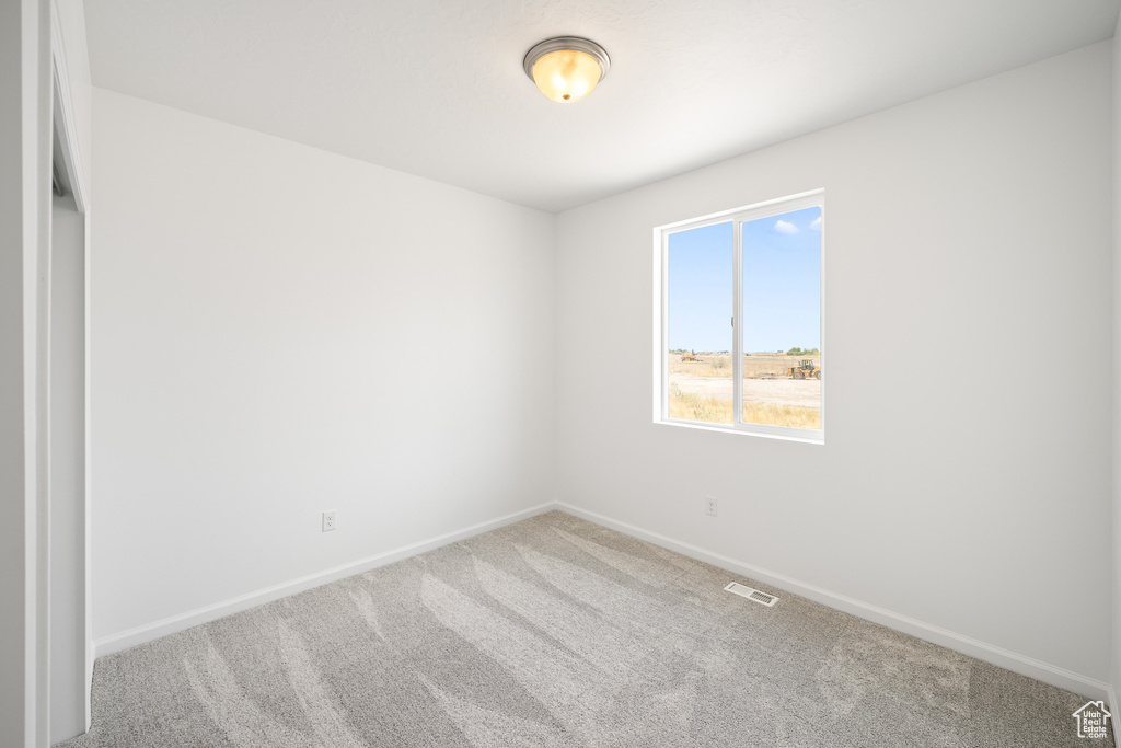 Empty room with carpet flooring