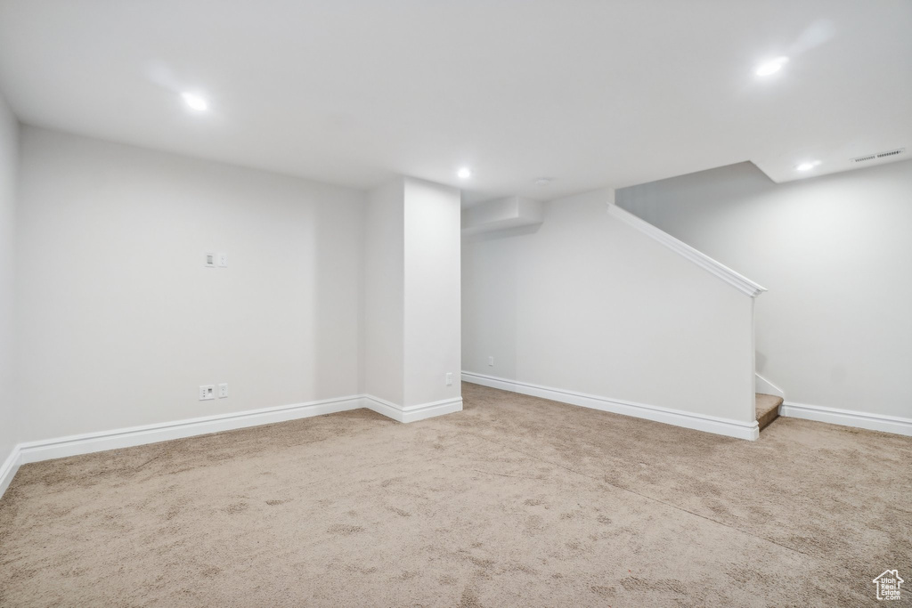 Basement featuring carpet