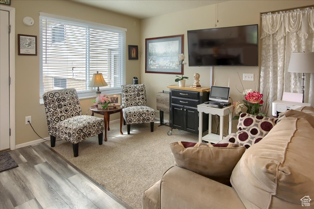 Living room with light hardwood / wood-style flooring