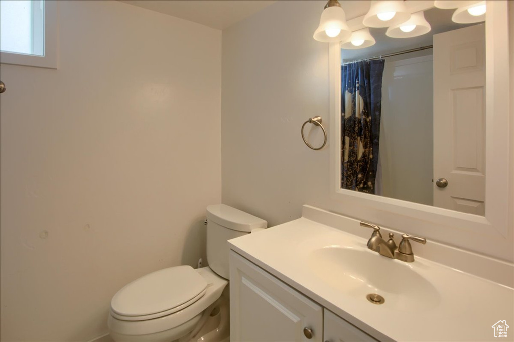 Bathroom with toilet and vanity