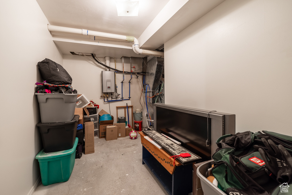 Basement featuring tankless water heater