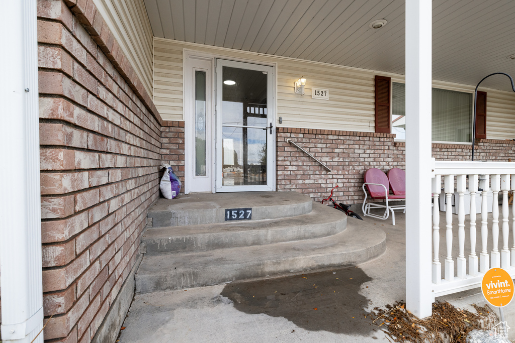 Property entrance with covered porch
