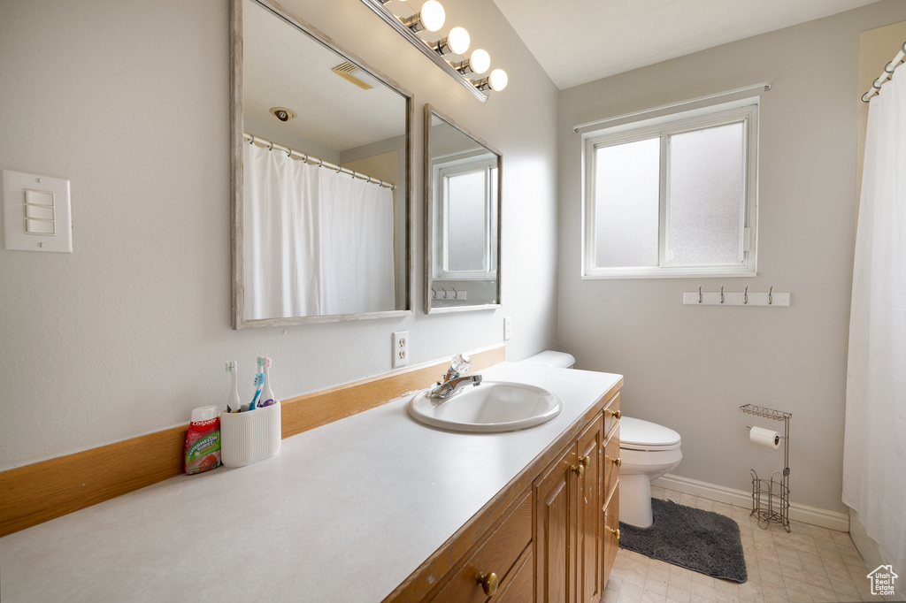 Bathroom with toilet and vanity