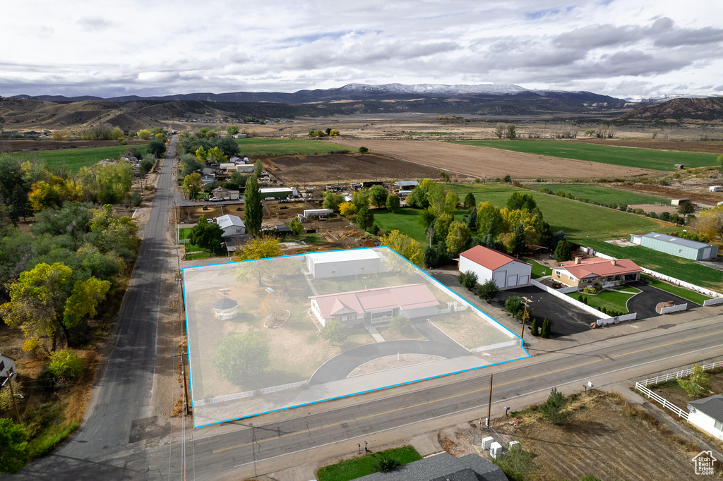 Drone / aerial view with a mountain view and a rural view