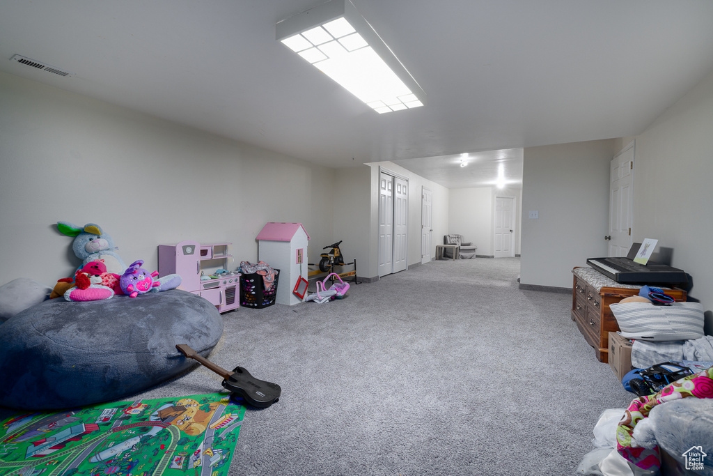 Game room featuring light colored carpet