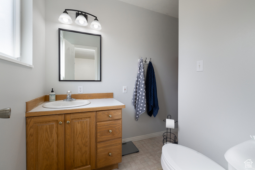 Bathroom featuring toilet and vanity
