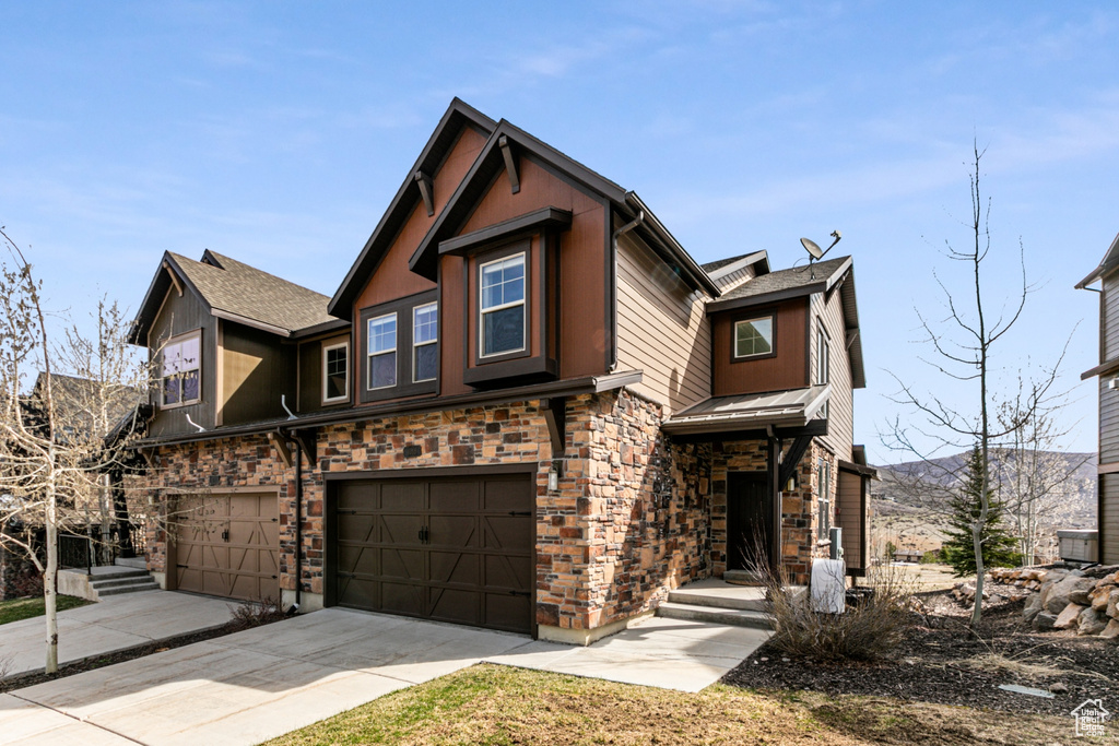 View of front of property with a garage