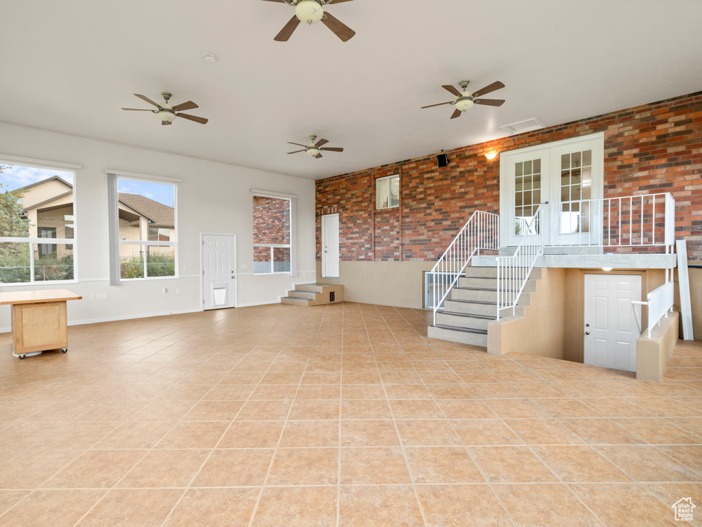 Interior space with french doors and ceiling fan