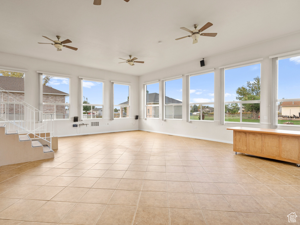 Unfurnished sunroom featuring a healthy amount of sunlight