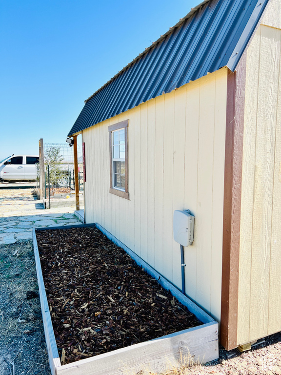 View of home's exterior with an outdoor structure