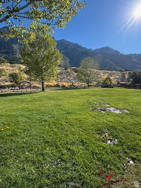 Property view of mountains with a rural view