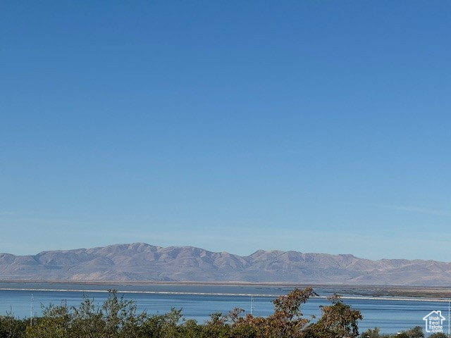 Mountain view featuring a water view