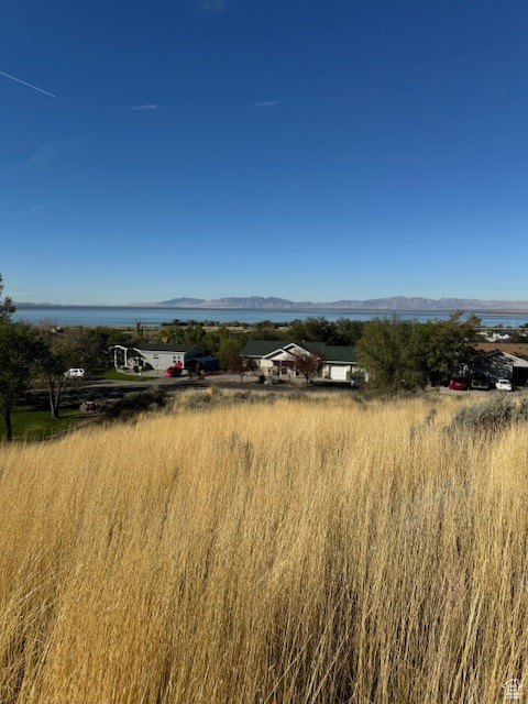 Property view of mountains featuring a water view