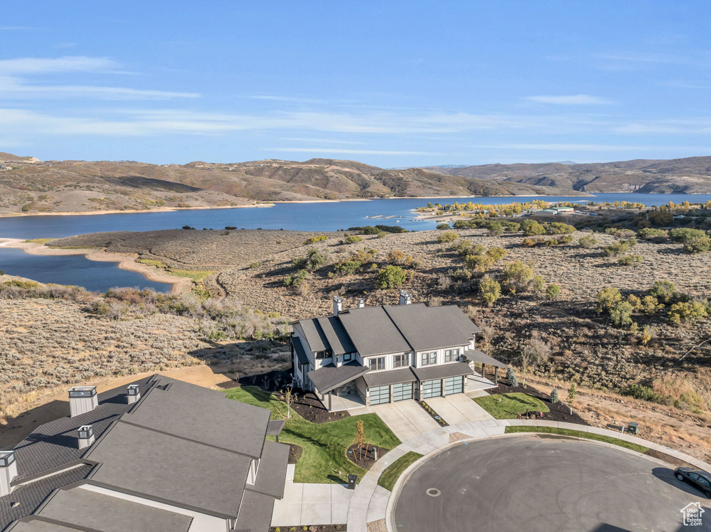 Drone / aerial view with a water and mountain view