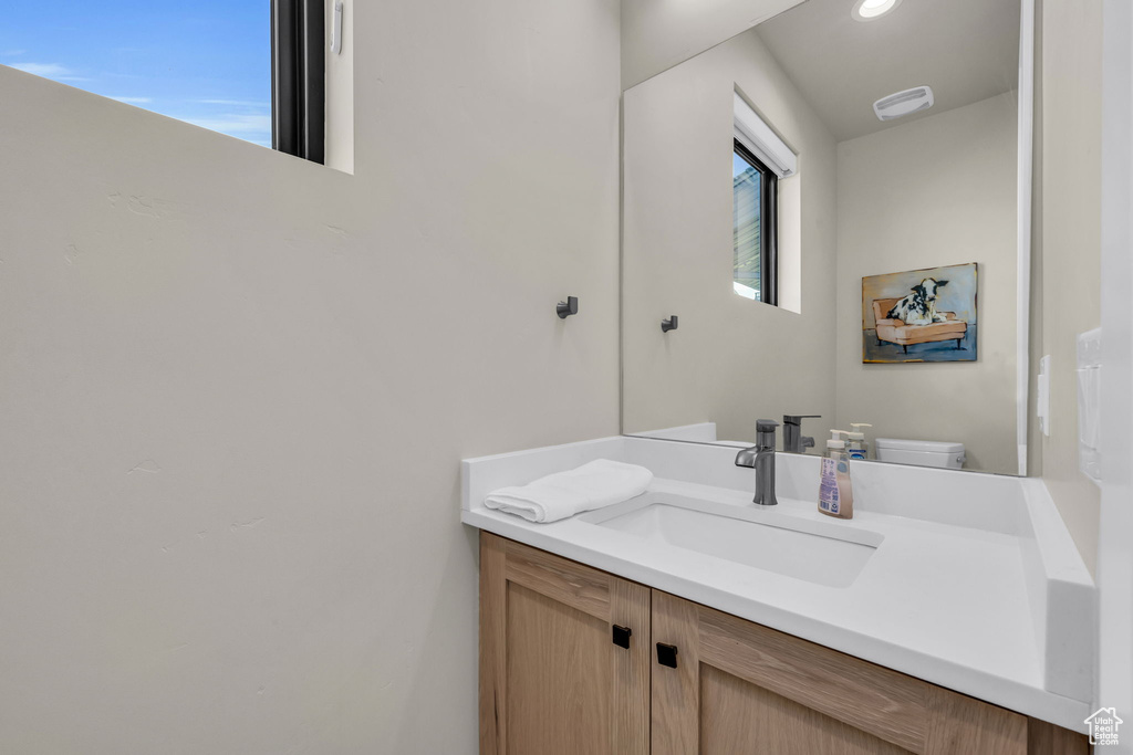 Bathroom with vanity and toilet