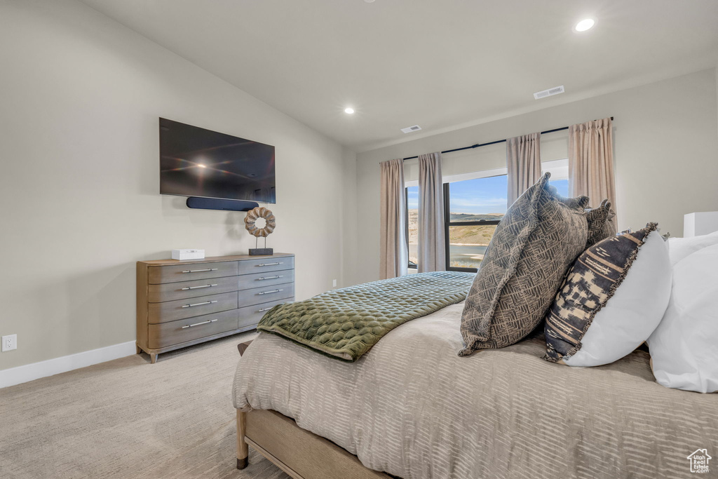 Carpeted bedroom with vaulted ceiling