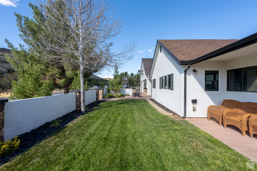 View of yard with a patio