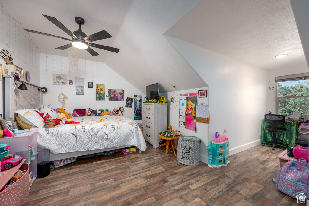 Bedroom featuring lofted ceiling, dark hardwood / wood-style floors, and ceiling fan