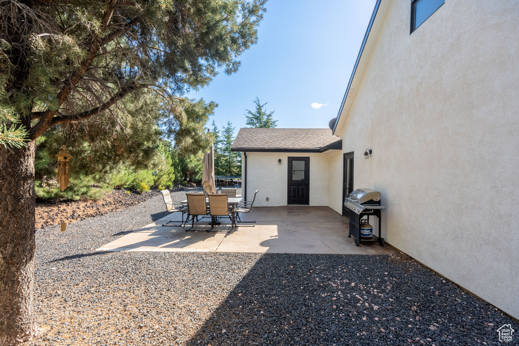 View of patio featuring a grill