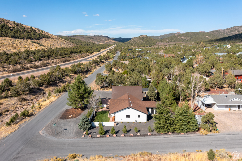 Birds eye view of property with a mountain view