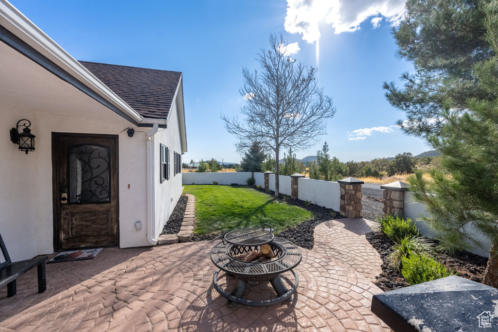 View of patio / terrace with a fire pit