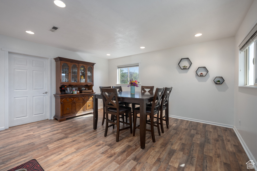 Dining room featuring dark wood-type flooring