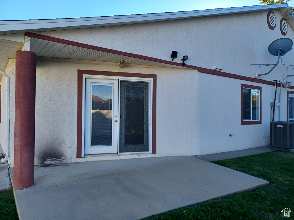 Back of house featuring a patio and central air condition unit