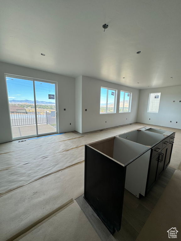 Kitchen with plenty of natural light and a kitchen island