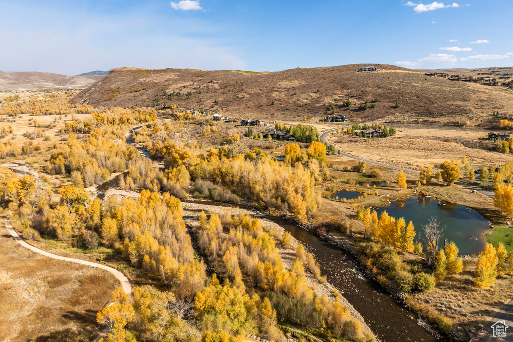 Property view of mountains featuring a water view