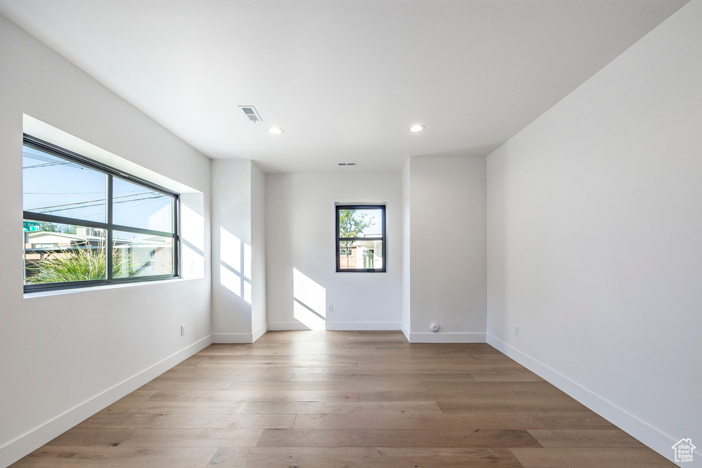 Empty room featuring light hardwood / wood-style flooring