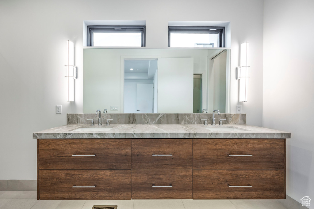 Bathroom featuring vanity and tile patterned floors