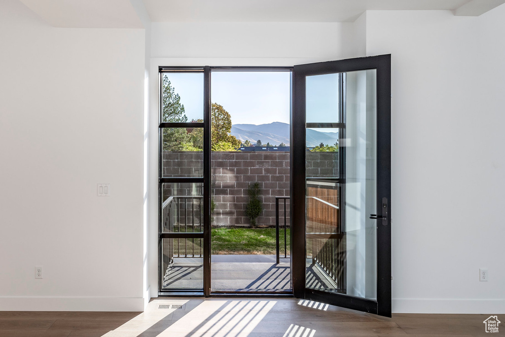 Entryway featuring a mountain view and hardwood / wood-style floors