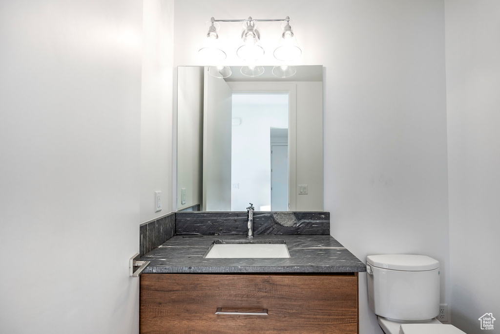 Bathroom featuring vanity and toilet