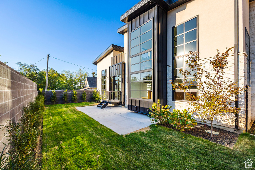 View of yard with a patio area