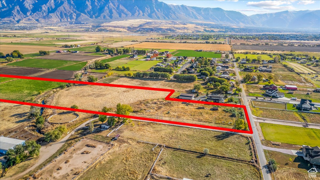 Birds eye view of property featuring a mountain view and a rural view