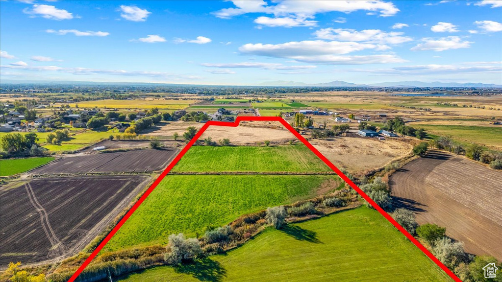 Birds eye view of property with a mountain view and a rural view