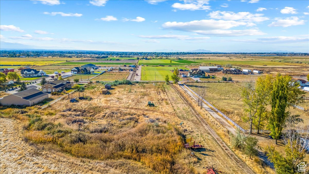 Birds eye view of property with a rural view