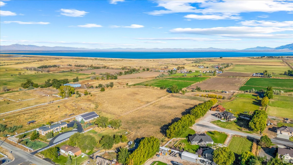 Drone / aerial view featuring a water and mountain view