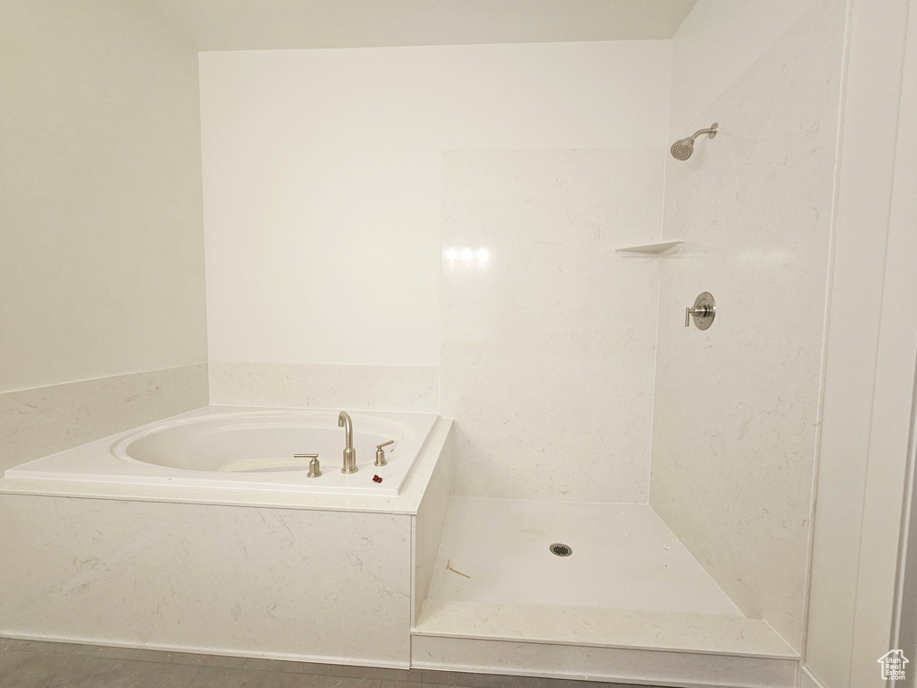 Bathroom featuring separate shower and tub