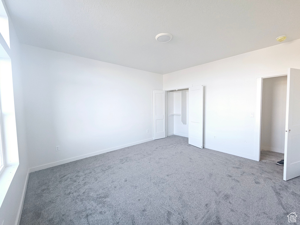 Unfurnished bedroom featuring carpet floors