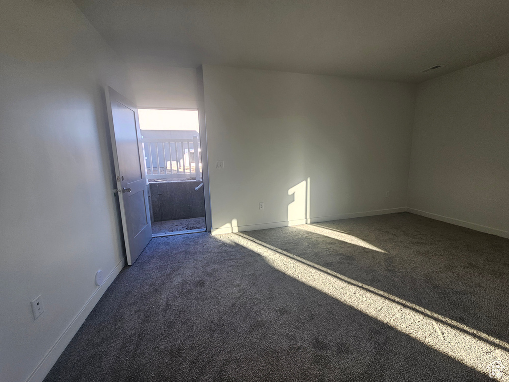 Empty room with carpet floors