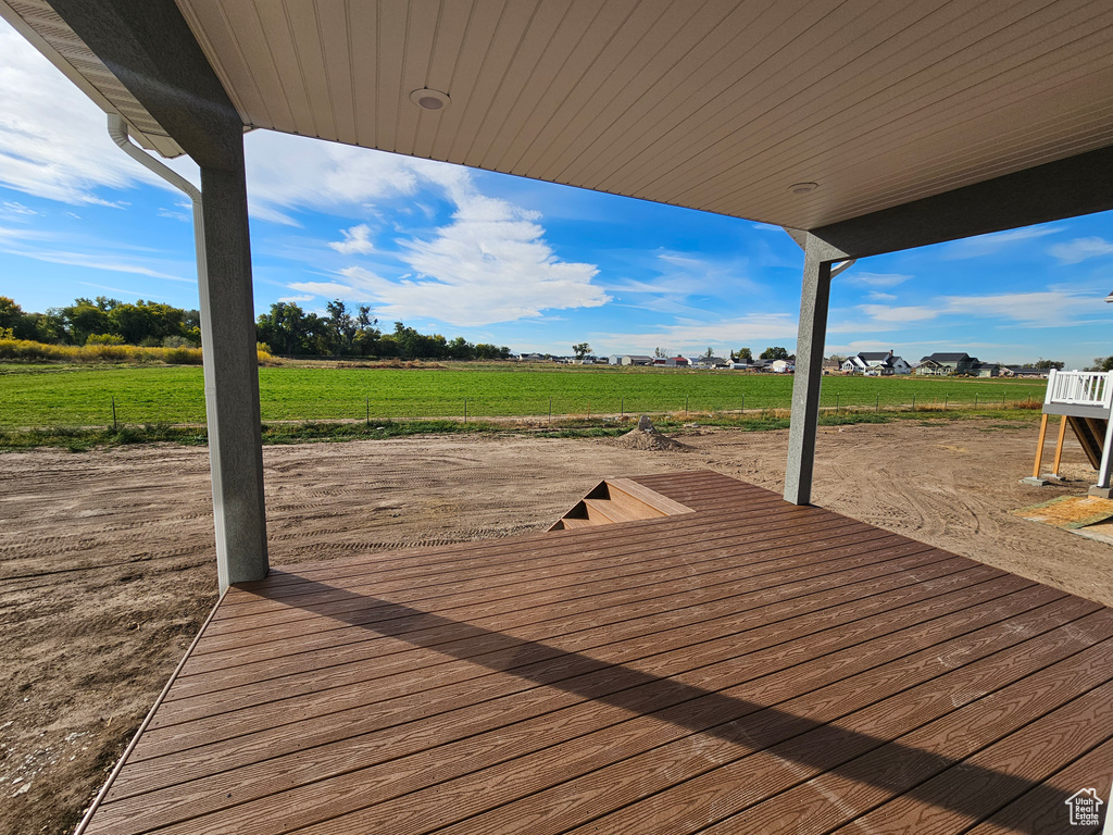 Wooden terrace featuring a rural view