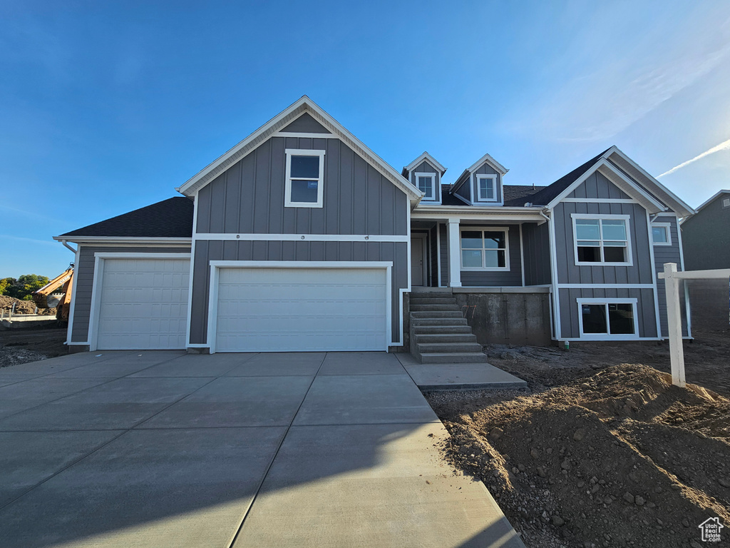 View of front facade featuring a garage