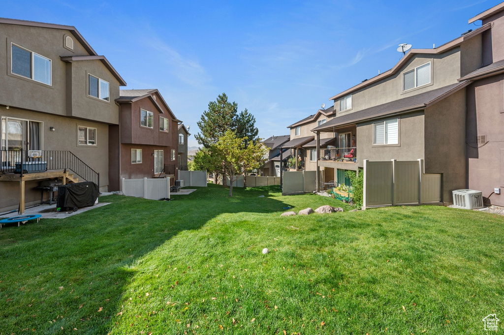 View of yard with central AC