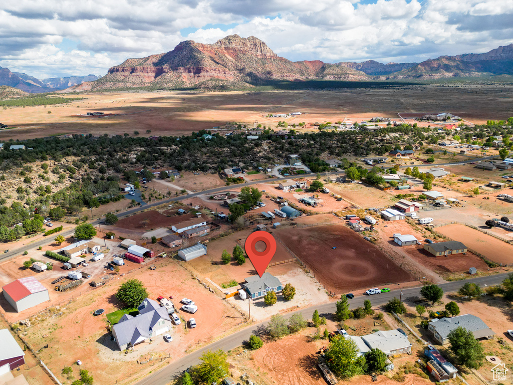 Birds eye view of property featuring a mountain view