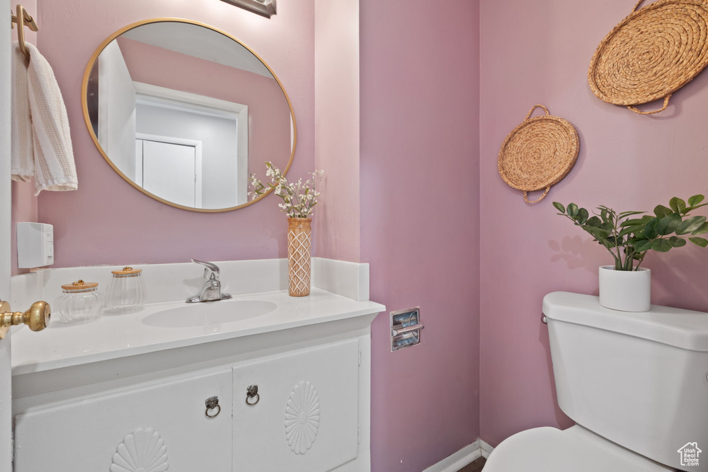 Bathroom with toilet and vanity