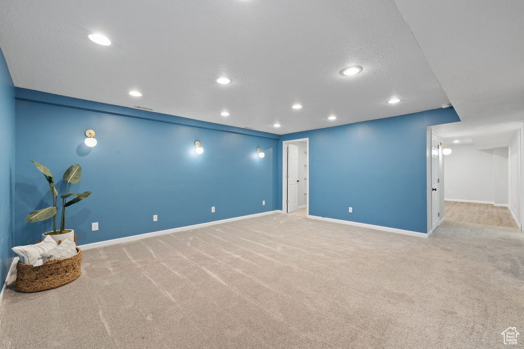 Unfurnished room with light carpet