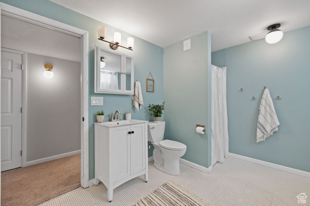 Bathroom with vanity and toilet