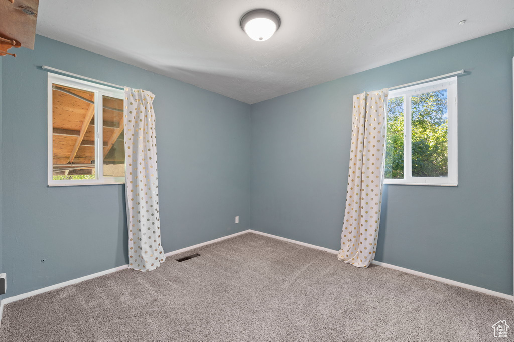 View of carpeted spare room